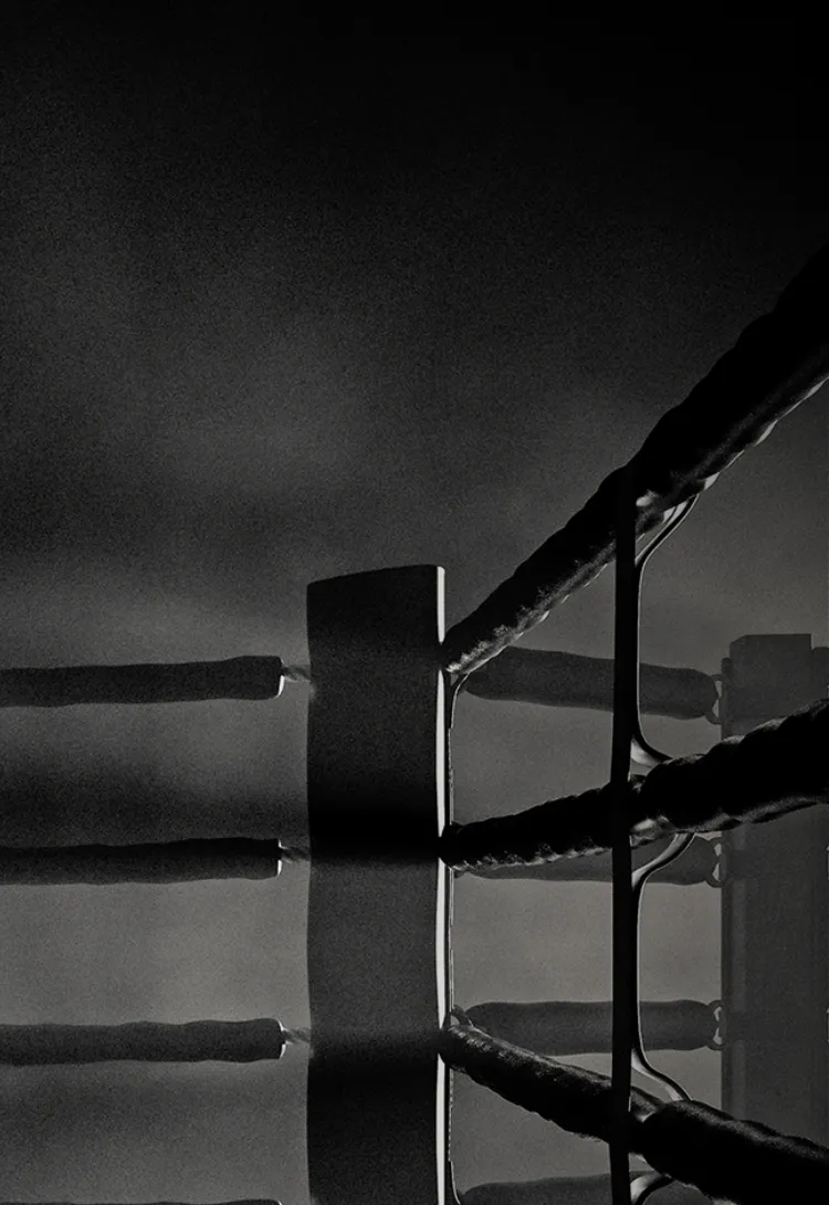 Black and white photo of boxing ring post