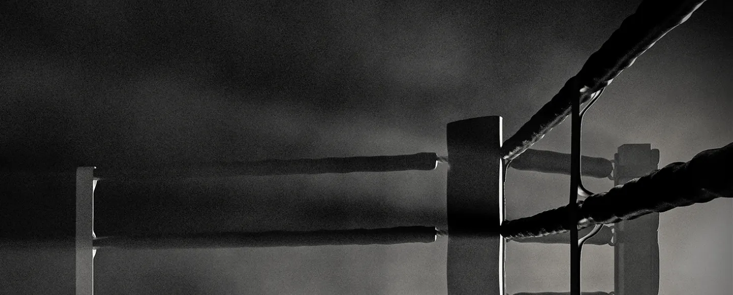 Black and white photo of boxing ring post